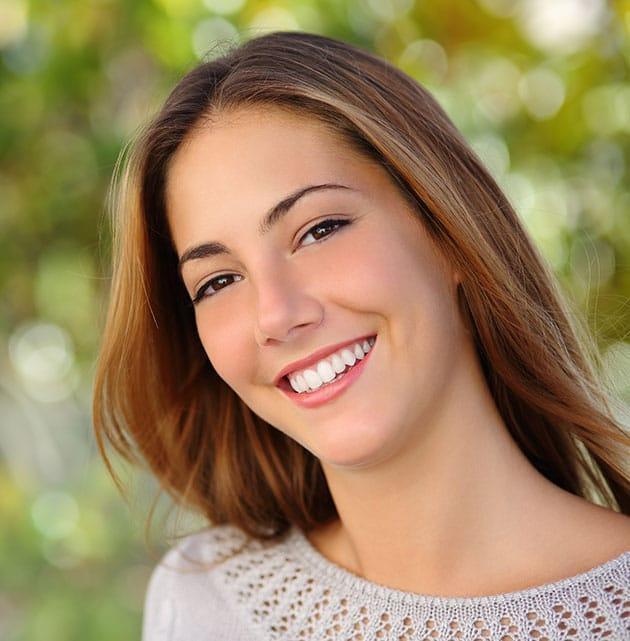 woman with brunette hair smiling