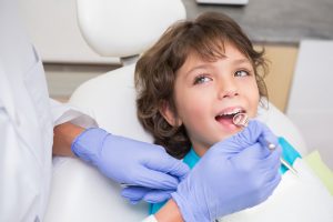 pediatric dentist in wichita, child getting dental checkup