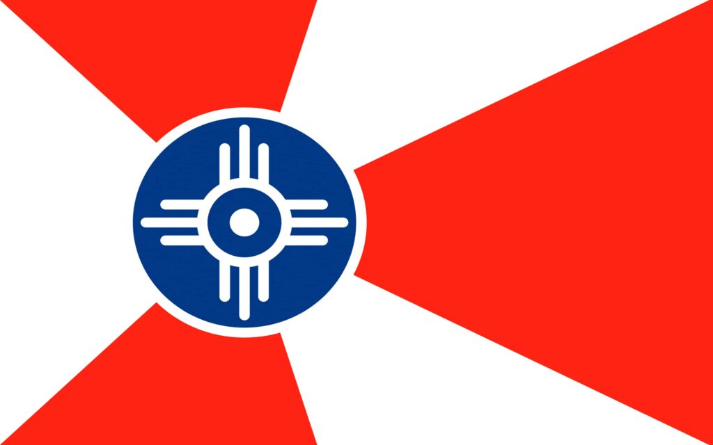 The Wichita city flag features three red triangles, three white triangles, and a blue center circle with a Native American symbol in the middle